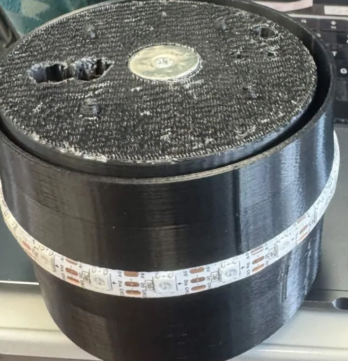 The SipSync prototype assembled with its printed top plate on, LED strip wrapped around the outer shell.