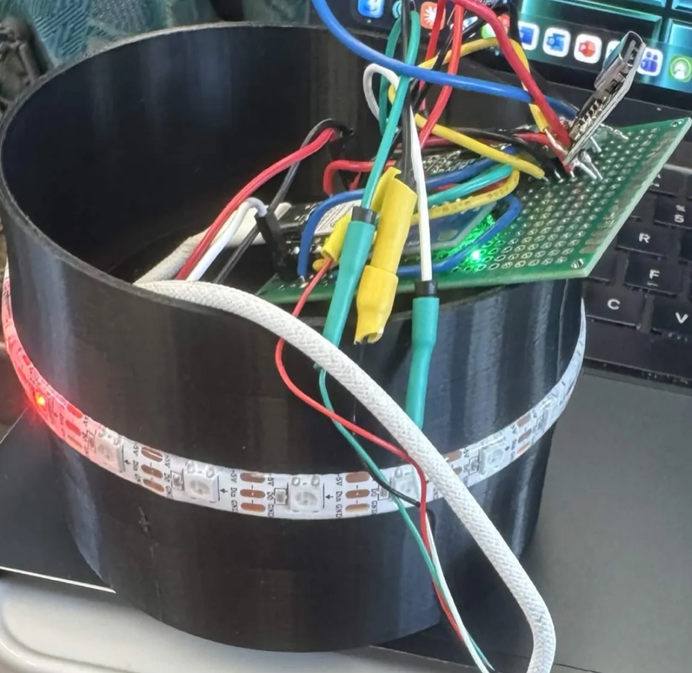 SipSync prototype with the lid removed, showing the Xiao ESP32C3, HX711 load cell amplifier and wiring on a soldered protoboard inside the 3D-printed shell.